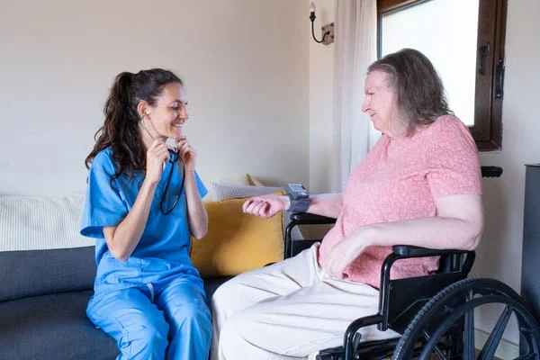 Carer supporting a veteran with everyday tasks at home