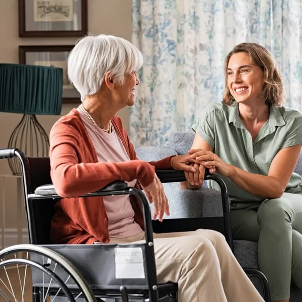 Carer and older person sharing a warm moment together