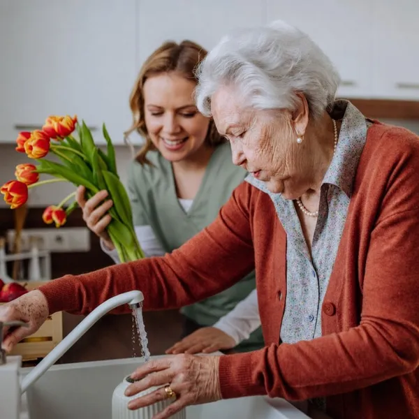 Supportive hands helping with daily tasks
