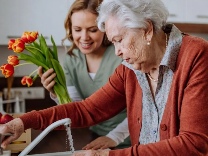Supportive hands helping with daily household tasks