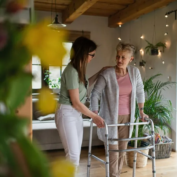 Carer assisting with personal care at home