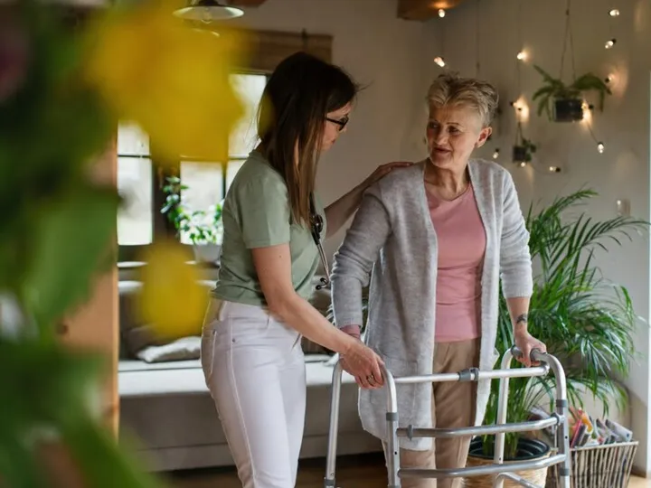 Carer assisting with personal care at home